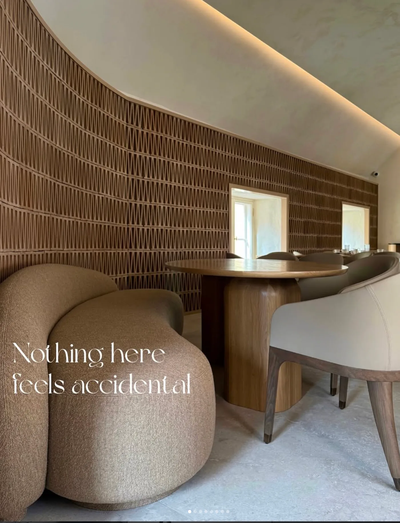 Curved lounge chairs and oak tables at Tête-à-tête